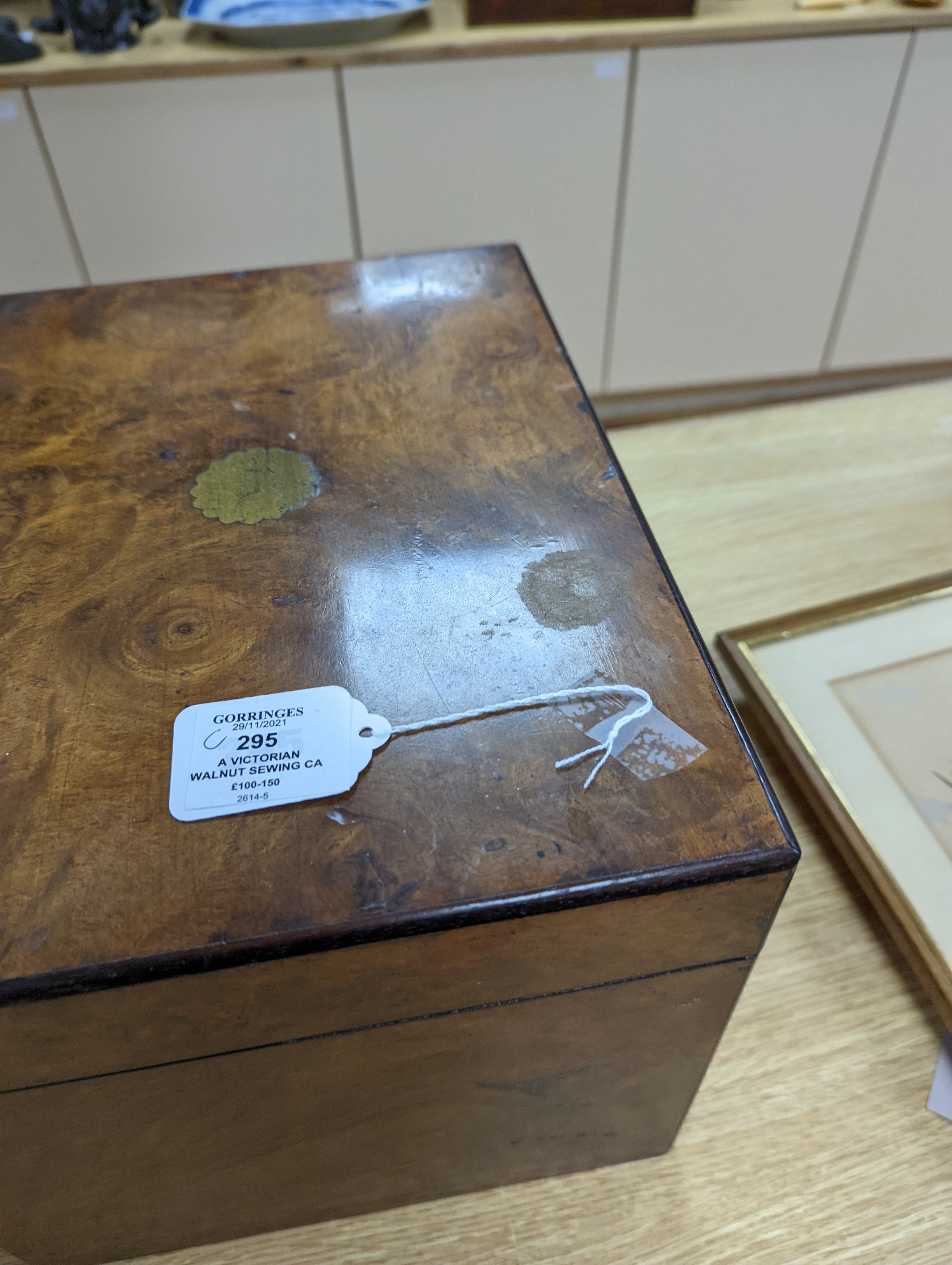 A Victorian walnut sewing casket, 34cm, containing sewing related accessories